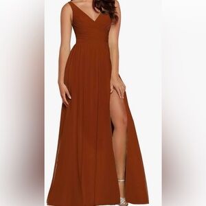 Women’s size 2 rust dress with side slit and corset back.
